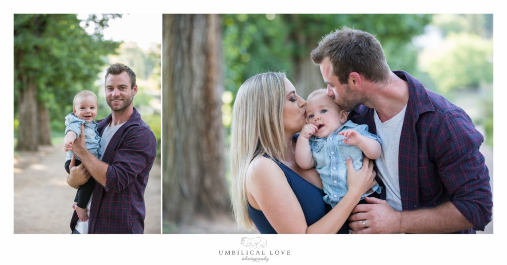 Dad and son smiling at camera in park