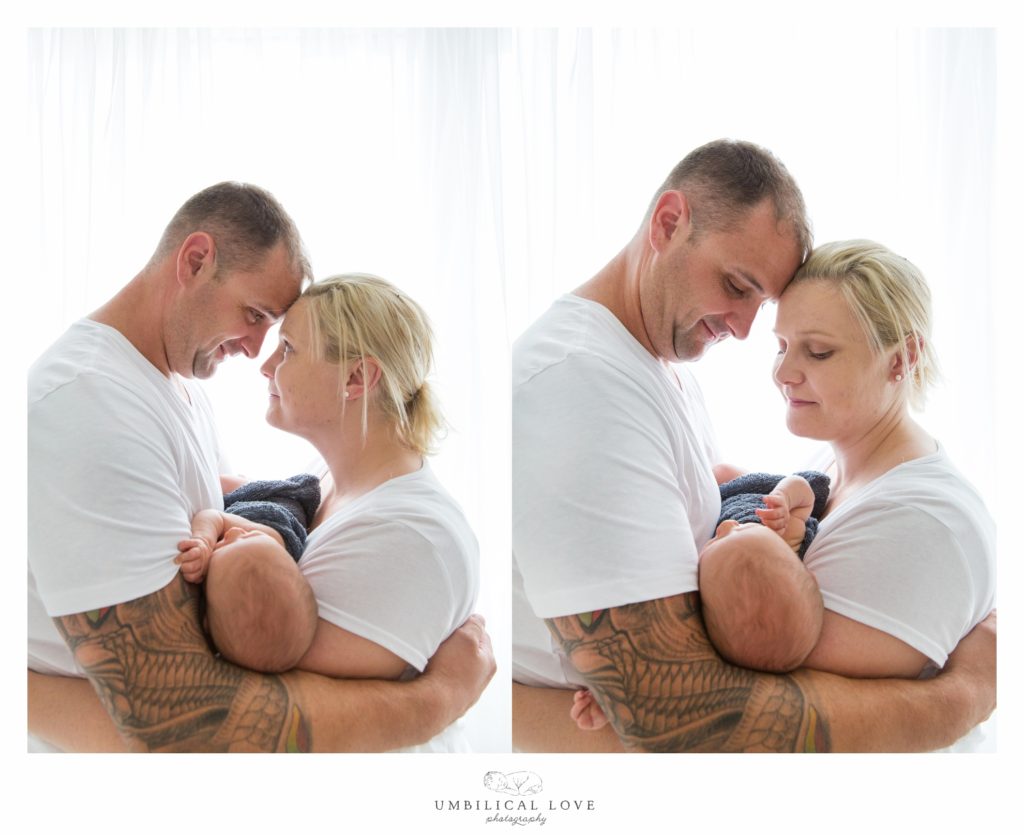 Parents holding baby