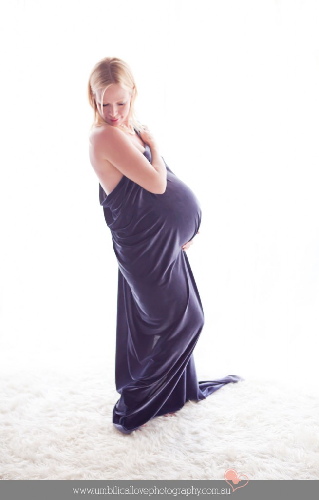 pregnant lady looking over her shoulder seductively 