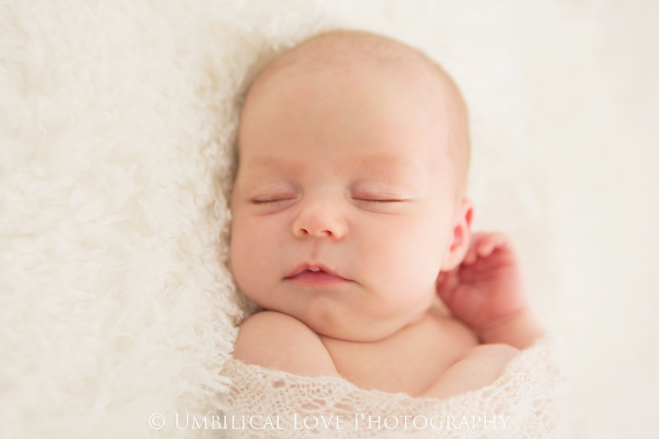 baby girl asleep all wrapped up 