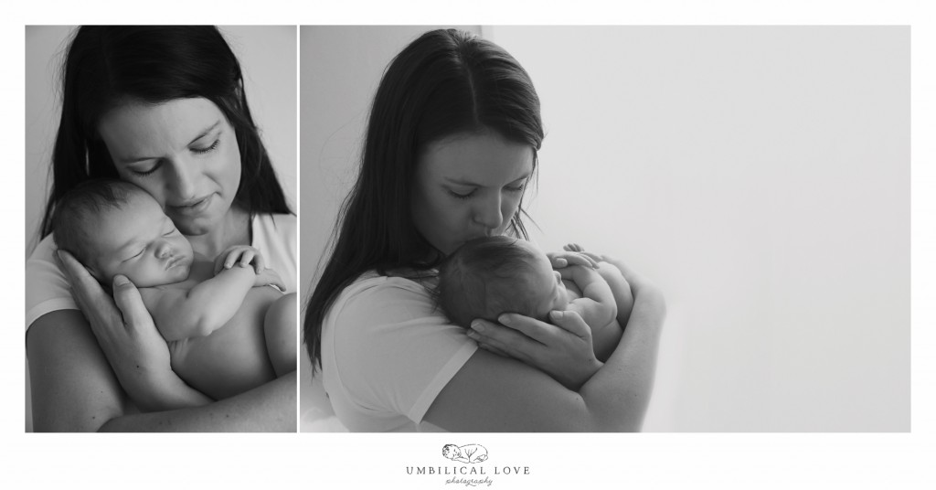 Mum holds baby close to her face and gives her a kiss