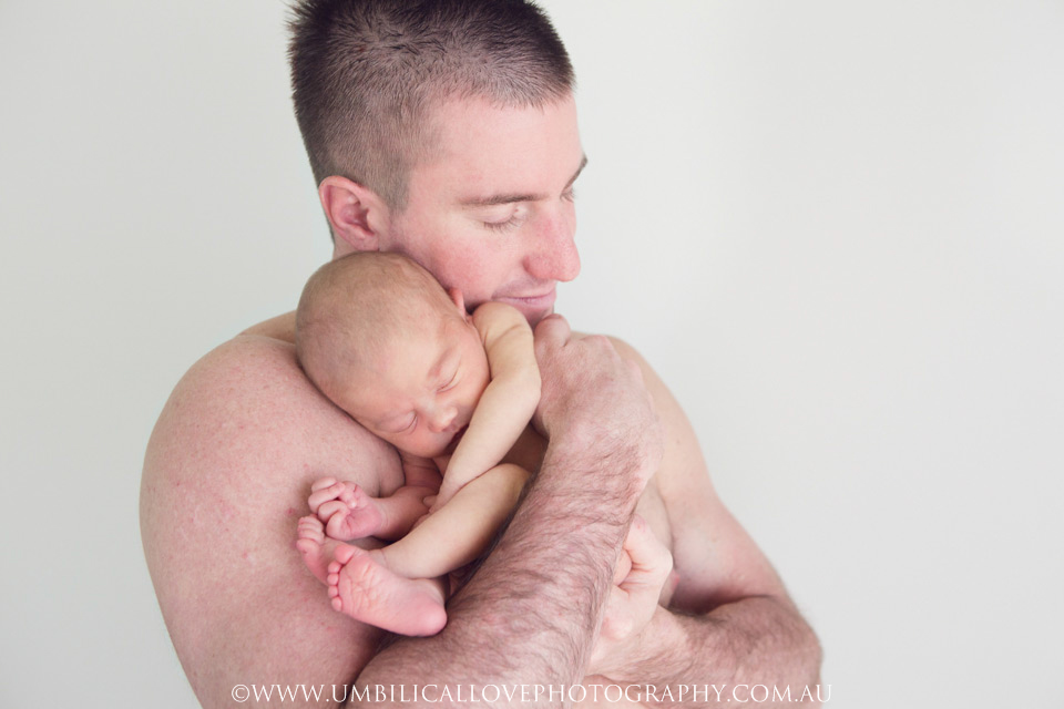 Wagga-Wagga-Newborn-Baby-Photographer baby snuggled up to her fathers shoulder