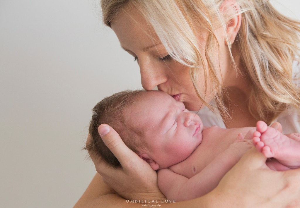 close up of mother kissing her son