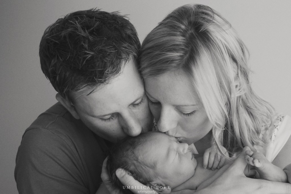 black and white image of their parents and their newborns