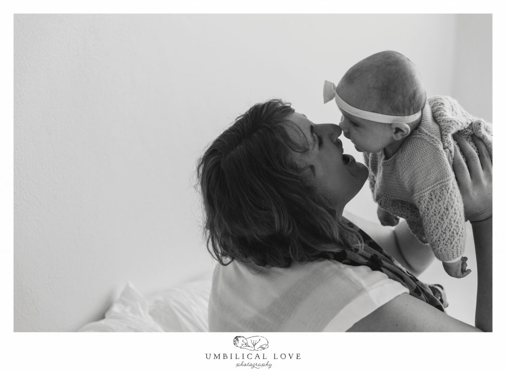 eskimo kiss of baby and mum