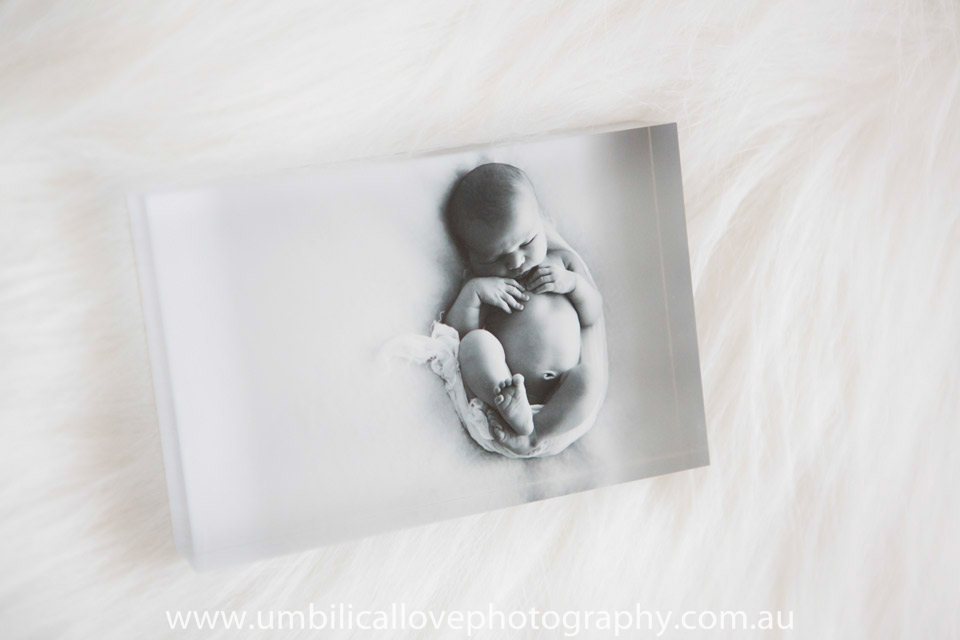 black and white acrylic tile of newborn