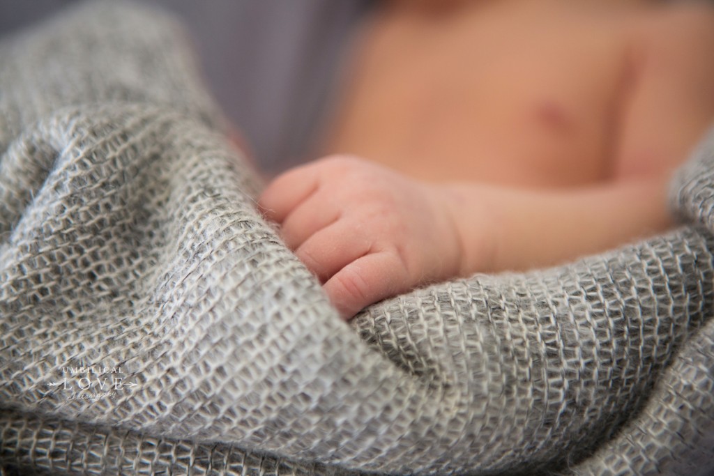 close up of newborns hand