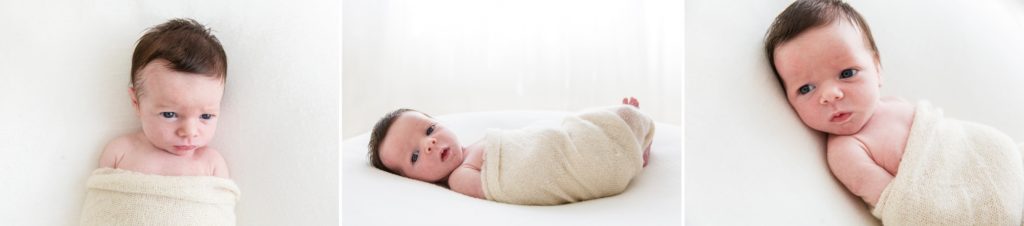 Baby girl lying on her back looking at the camera