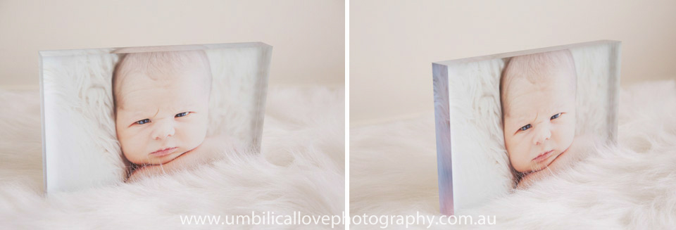 close up of babys face in an acrylic tile