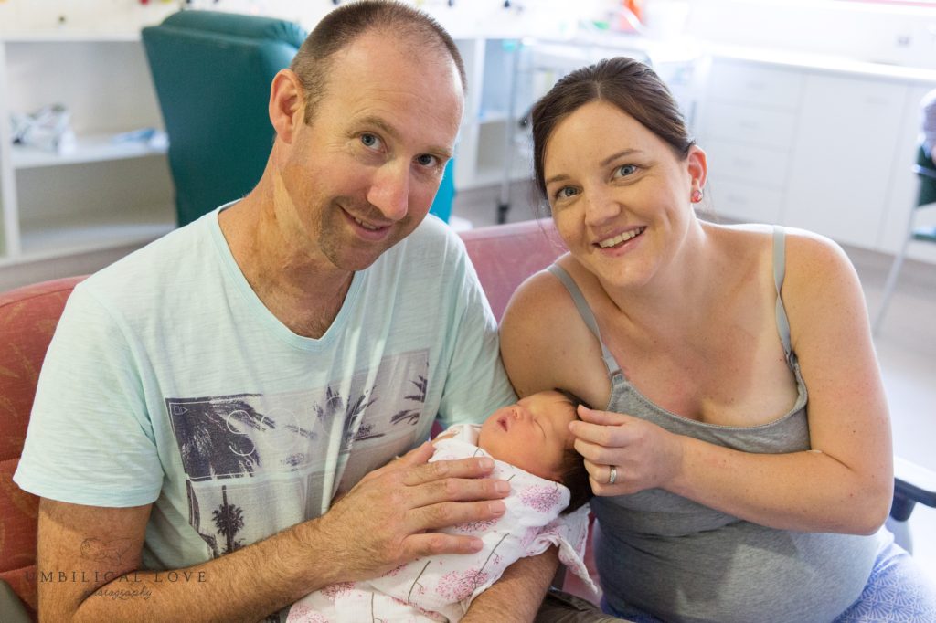 Mum and dad with new baby daughter in the hospital