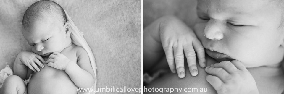 black and white close up of babys face and hands