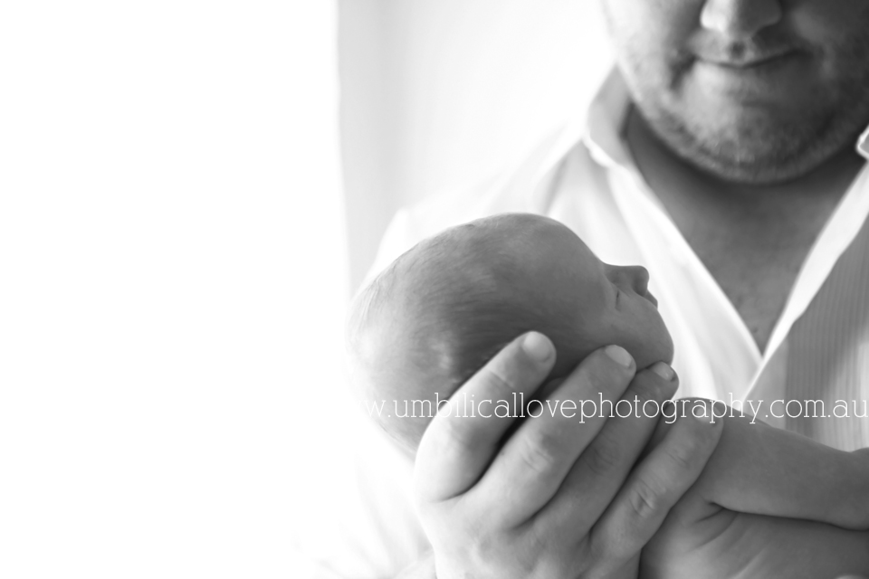 dad holding his new baby