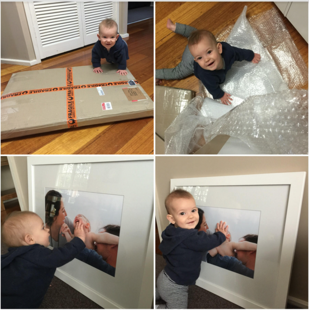 framed professional photo with baby checking it out