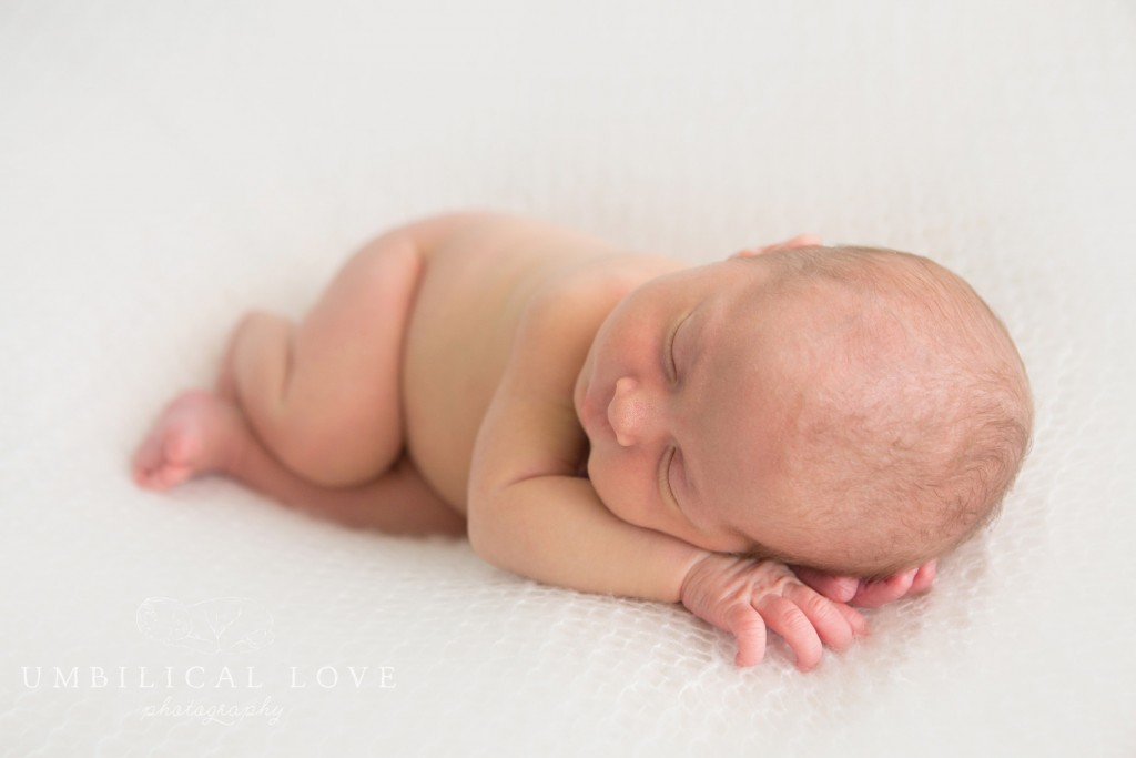 newborn baby photo on a soft white blanket