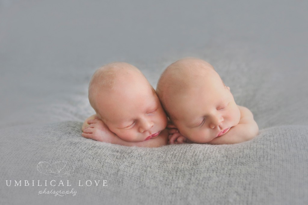 twin newborn brothers sleeping side by side
