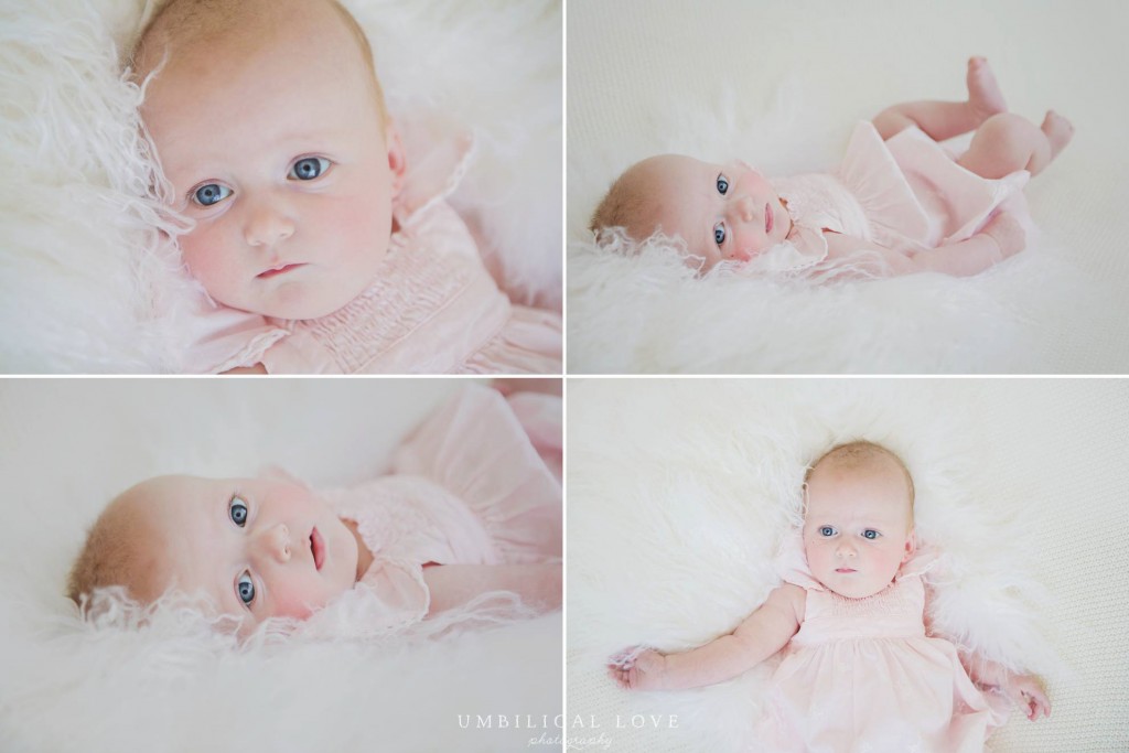 The big blue eyes stand out at they look at the camera from this little baby girl lying on her back