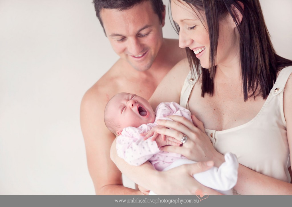 baby photographer deception bay mum holding her new baby looking at baby's first yawn