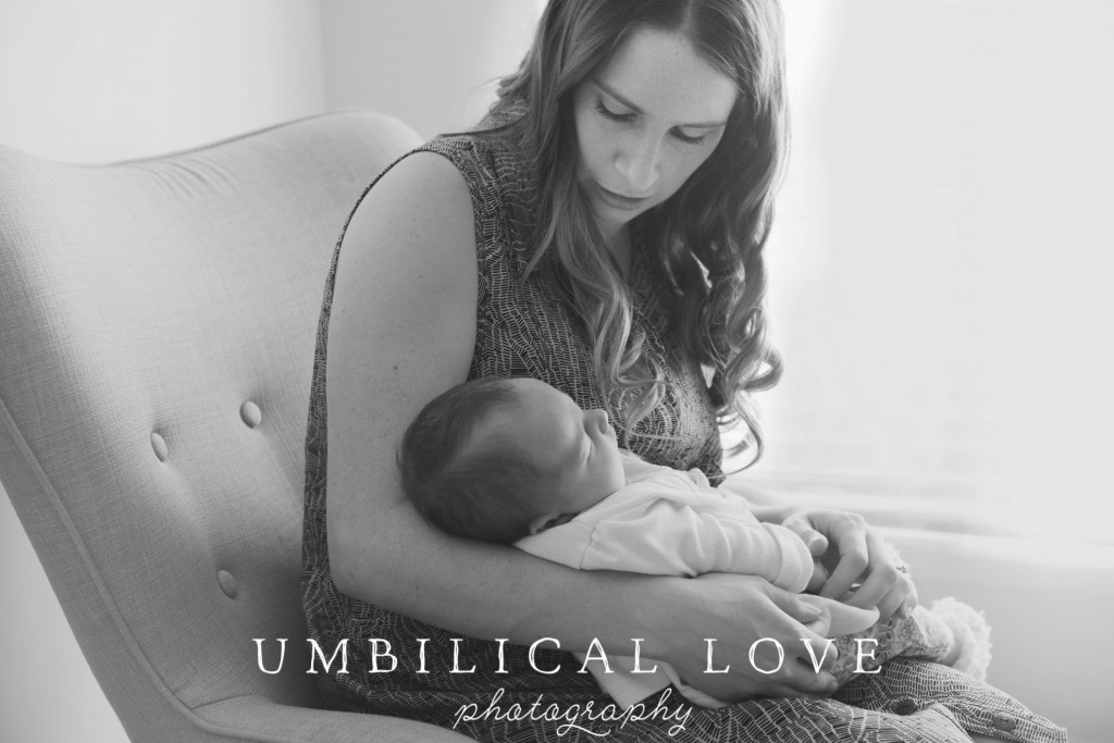 black and white of mother holding her newborn