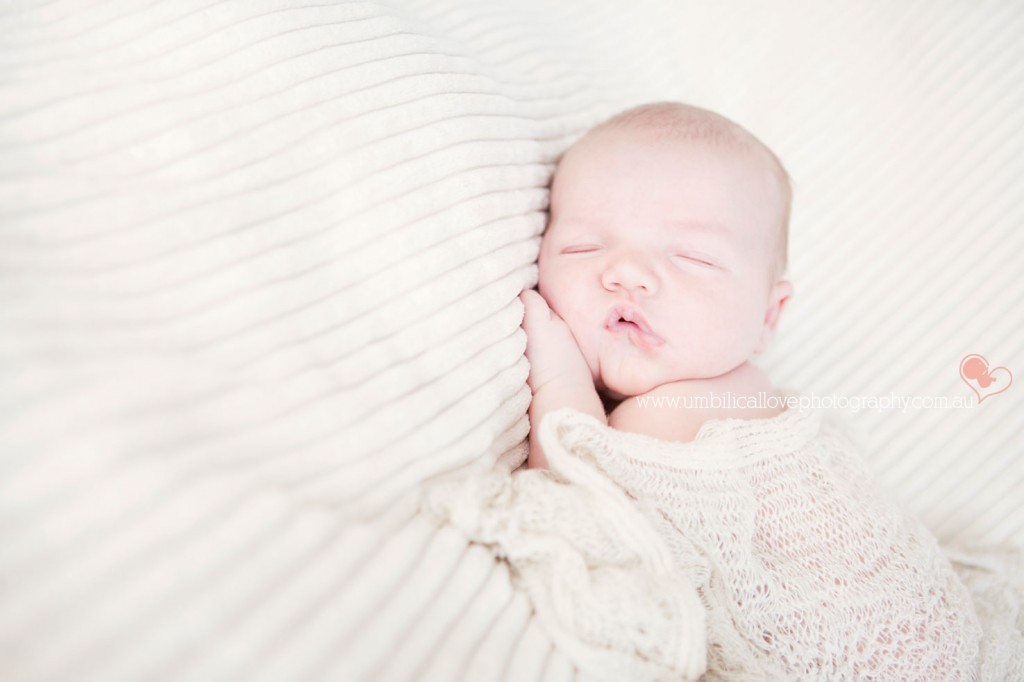 baby swaddled with a beautiful wrap
