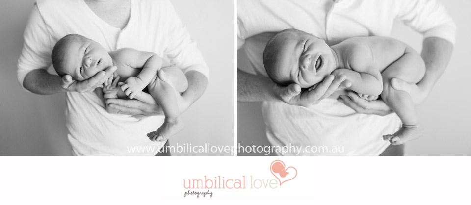 close up of baby in fathers arms