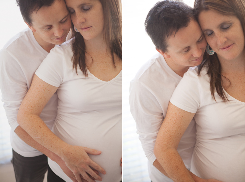 pregnancy portraits with husband and wife together holding the pregnant tummy
