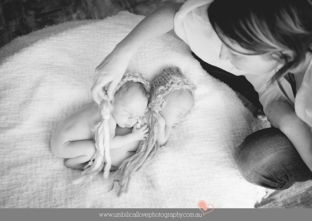 settling twins during their newborn photography session