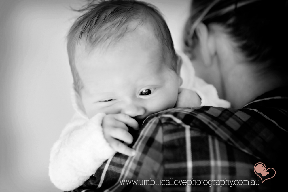 new baby photography sunshine coast buderim baby sucking hand over mums shoulder