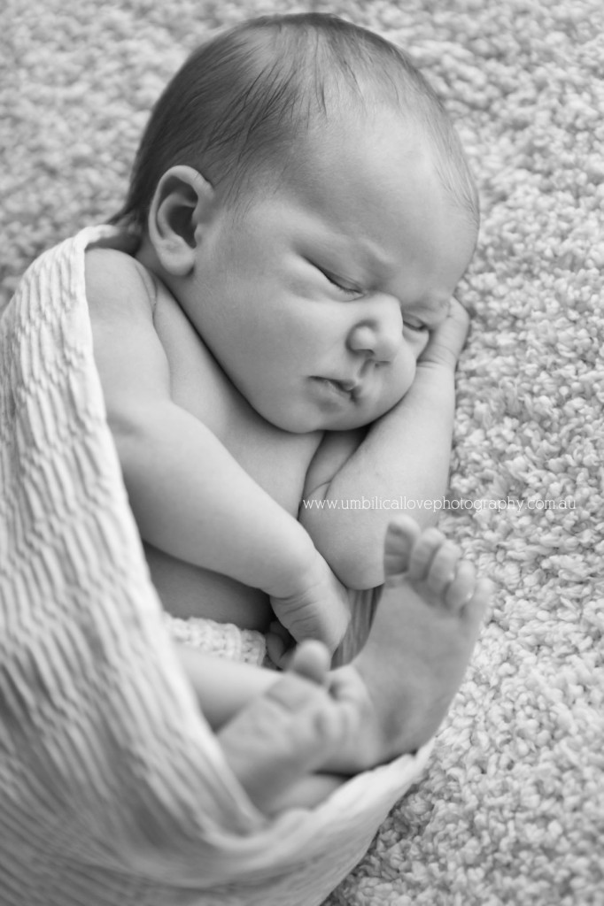 Sunshine-Coast-Newborn-&-Baby-Photography-7-days-old tiny newborn swaddled tightly laying on side
