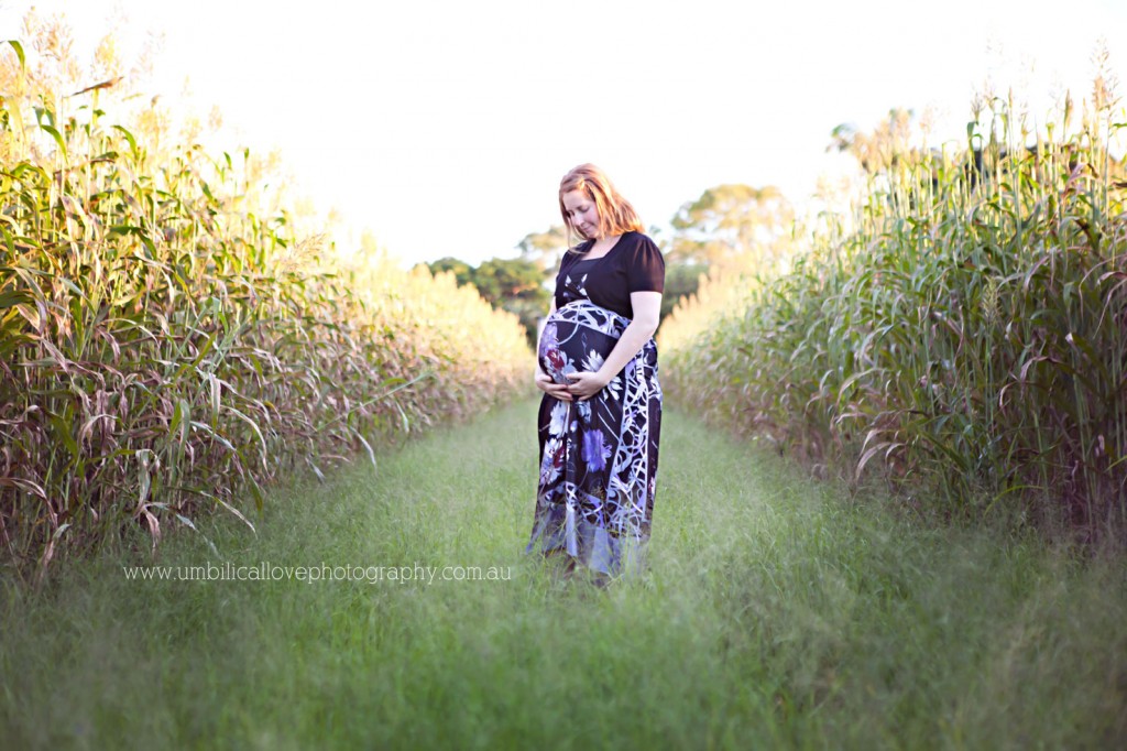pregnant girl looking at her belly