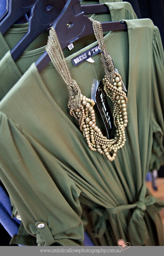 olive green elegant maternity dress with gold brilliant necklace