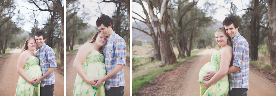 couple holding the lady's pregnant belly 