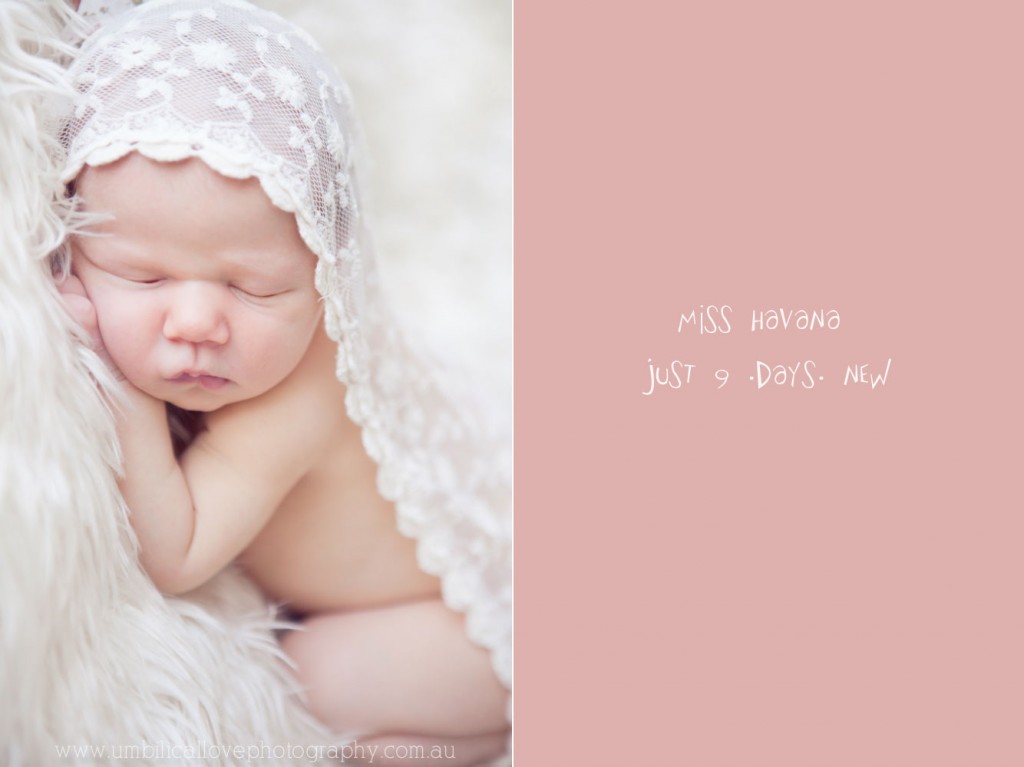 newborn laying on her hands with lace draped over her