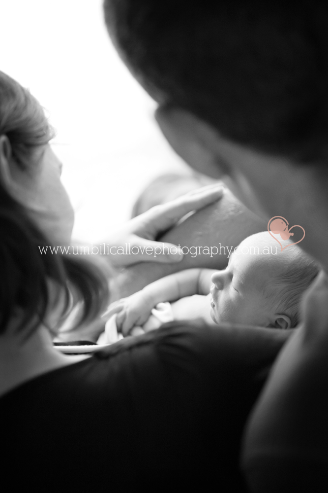 sunshine coast baby photos looking at baby through mums arms