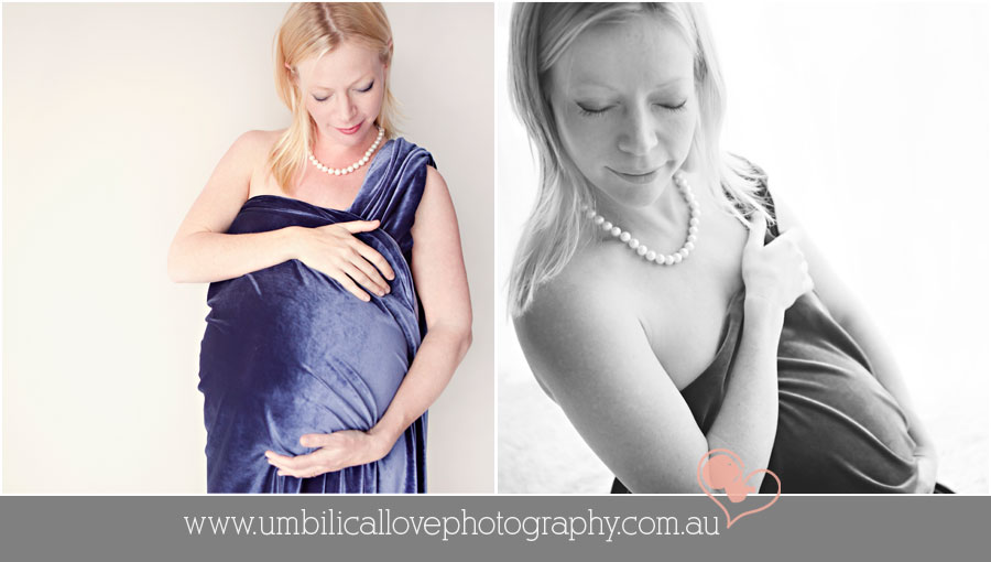 pregnant woman pregnant with twins holding her belly with material draped