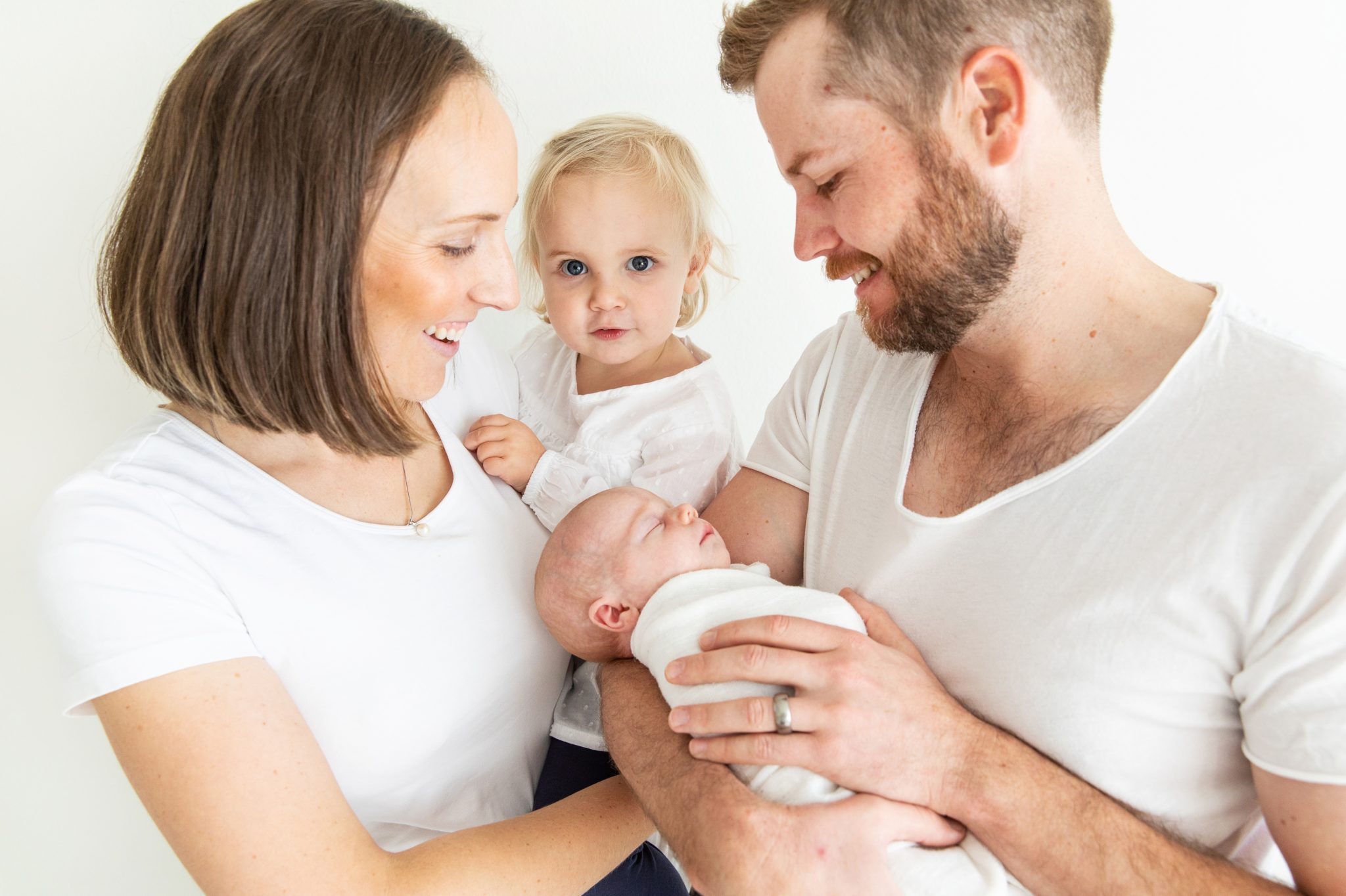 Family look at their adorable new addition