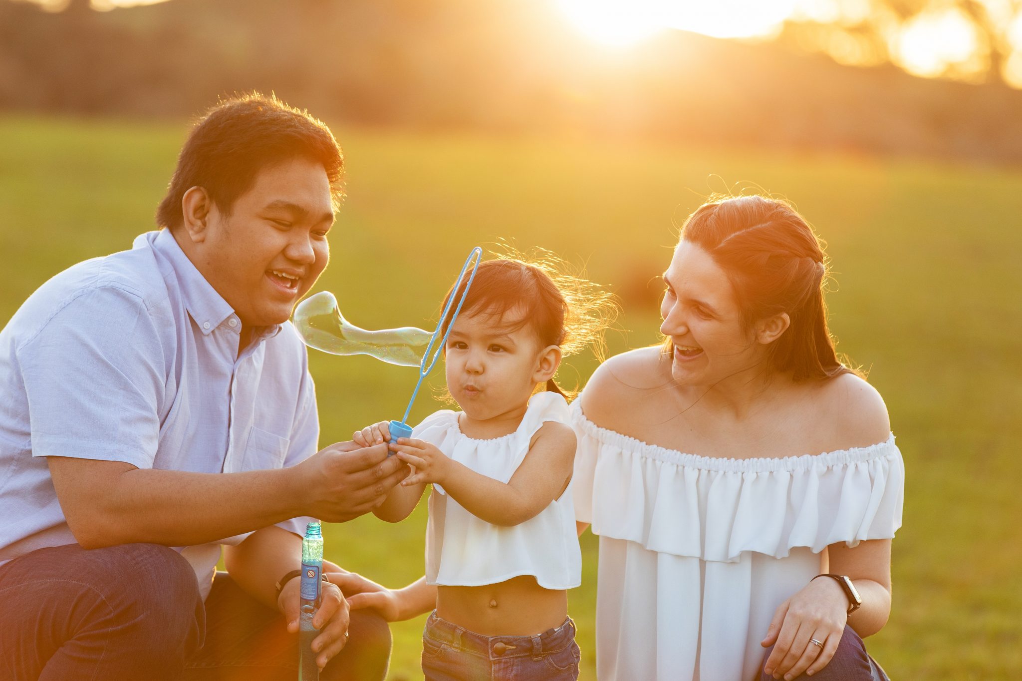 Family blow bubbles together